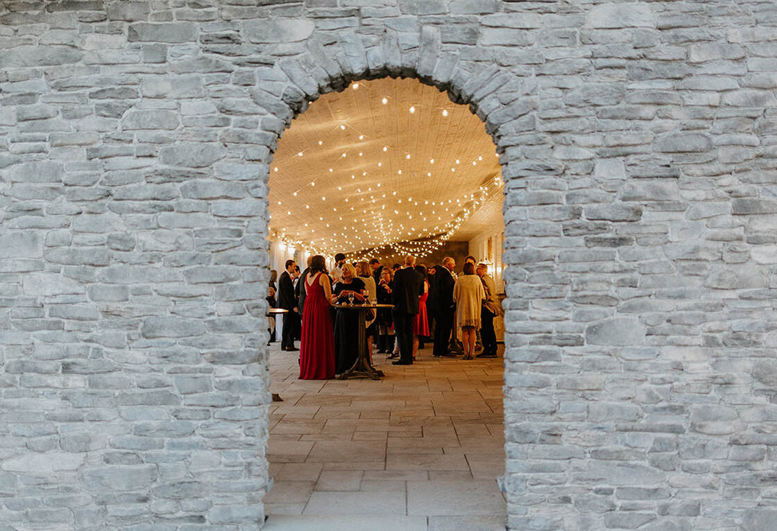 Wedding venue entrance, lighting, guests